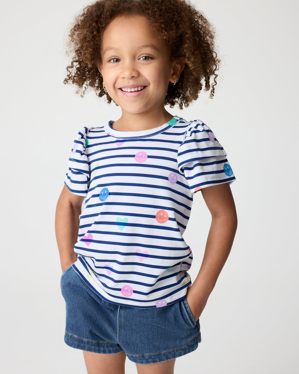 Close up of girl wearing the Smiley Stripes Double Flutter Tee