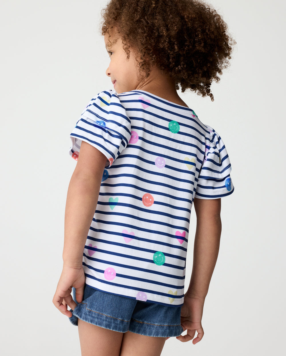 Back view of girl wearing the Smiley Stripes Double Flutter Tee