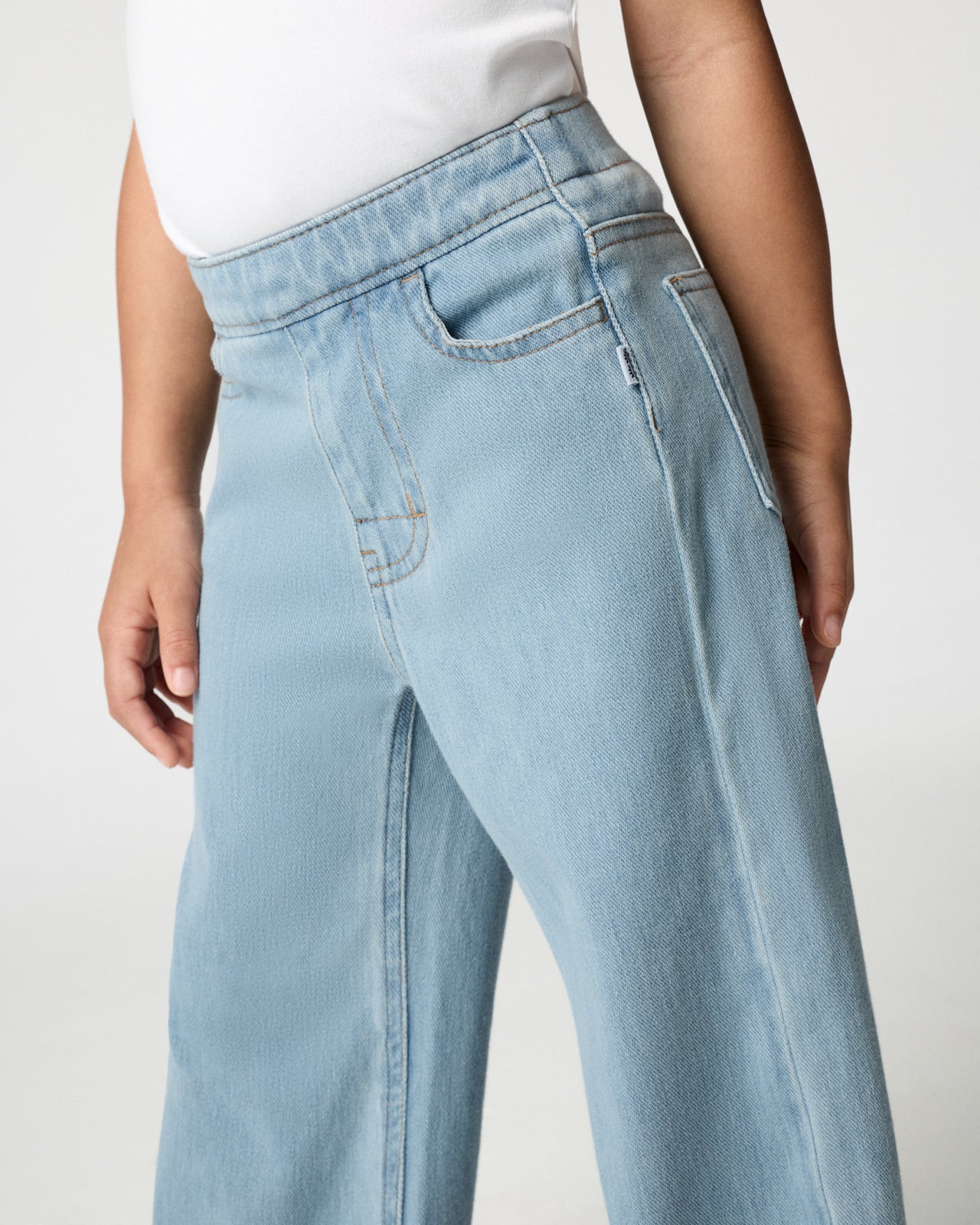Close up of the pocket details on the Light Blue Wide Leg Denim Pants