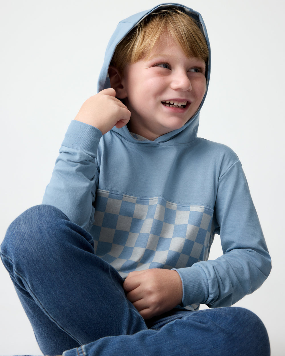 Boy wearing the Dusk Blue Checks Relaxed Hooded Tee with the hood on