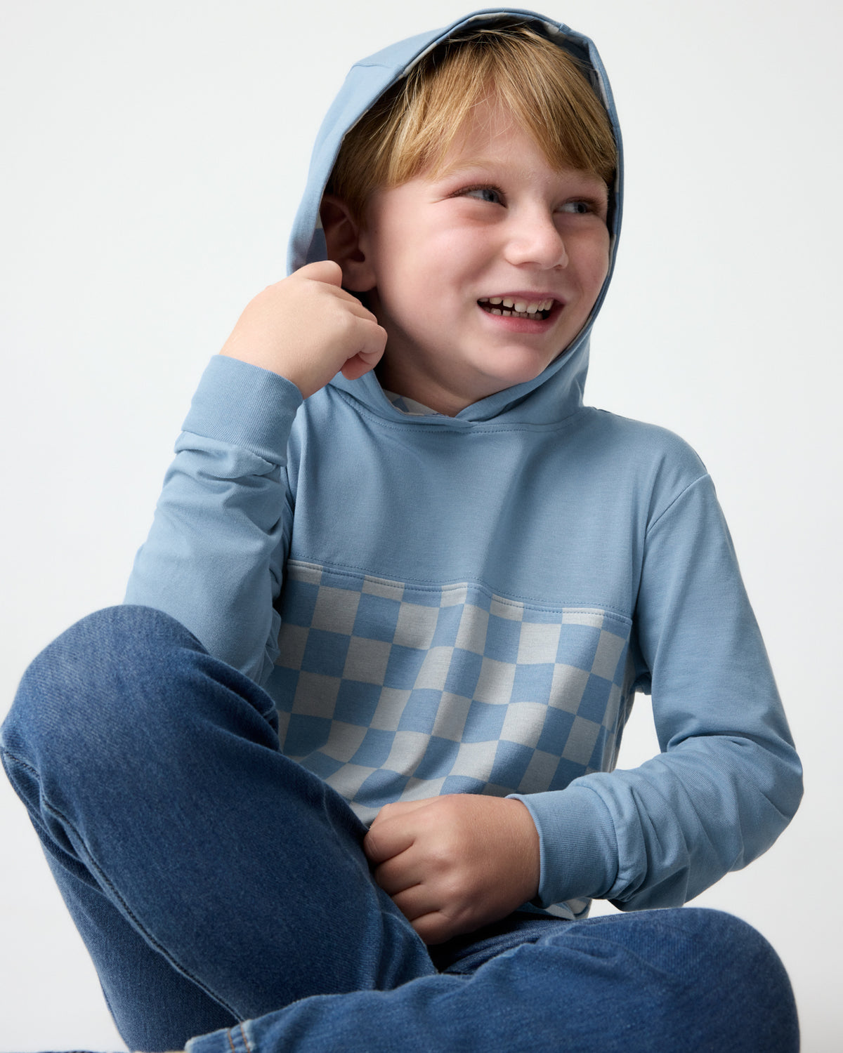 Boy wearing the Dusk Blue Checks Relaxed Hooded Tee with the hood on