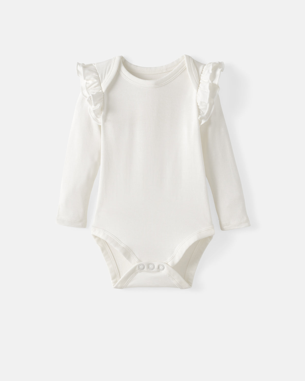 A long-sleeve baby bodysuit in off-white with delicate ruffle details on the shoulders, displayed flat against a light gray background.