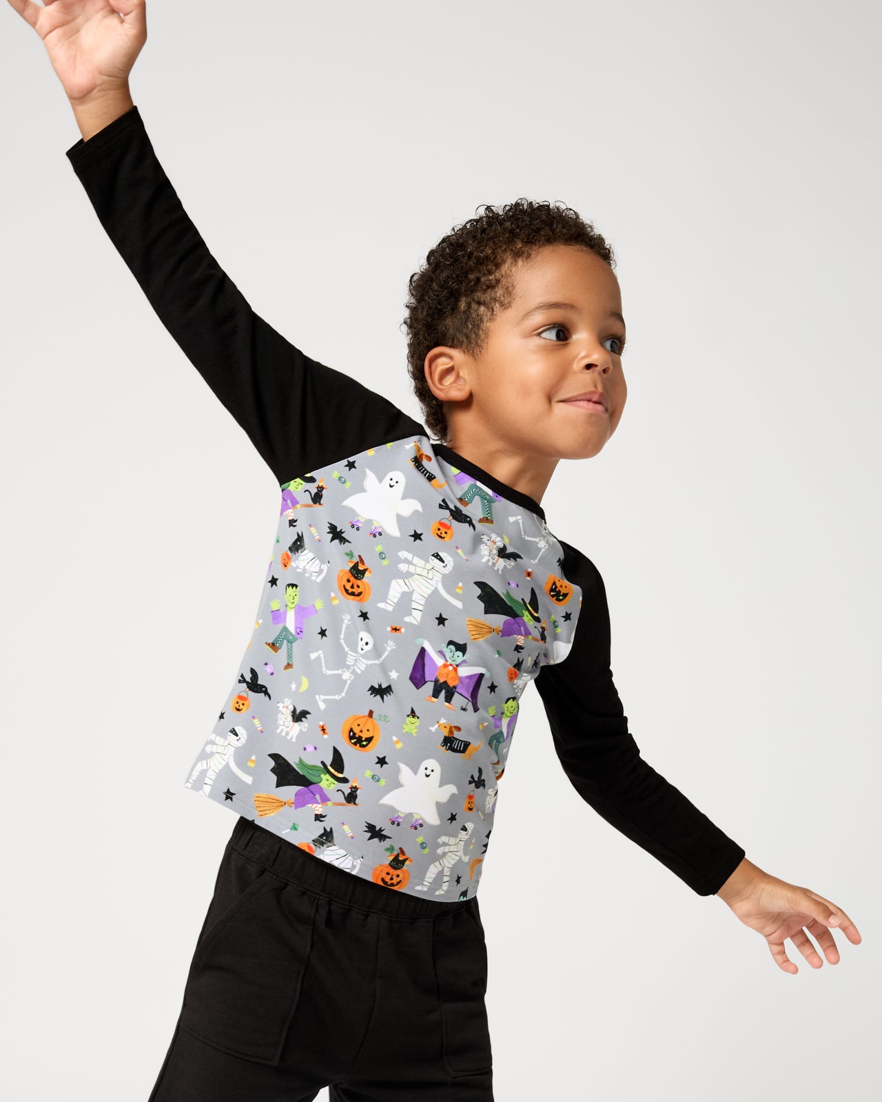 Posing boy wearing the Dracula's Disco Raglan Tee