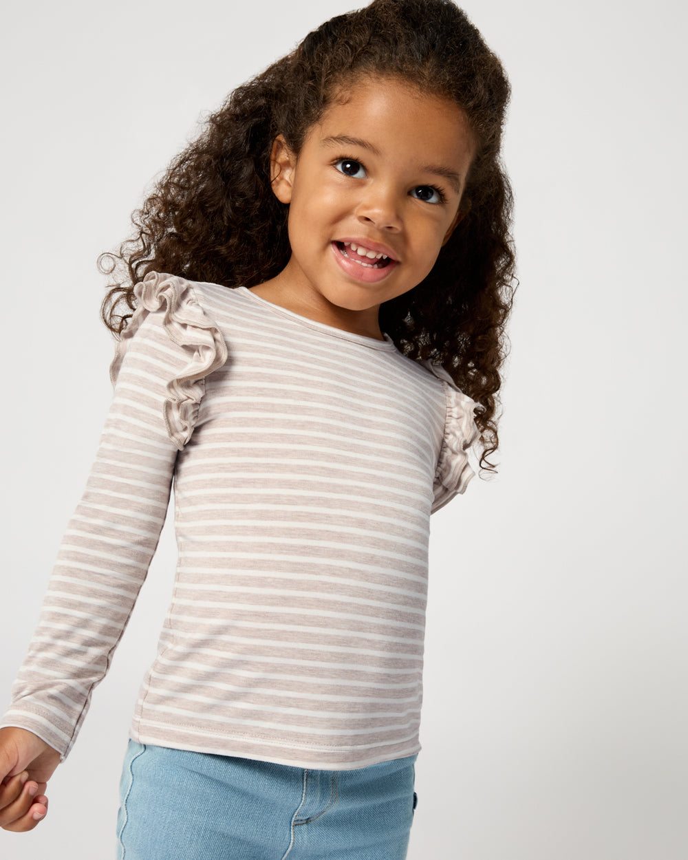 Close up of girl wearing the Linen Heather Stripe Flutter Tee