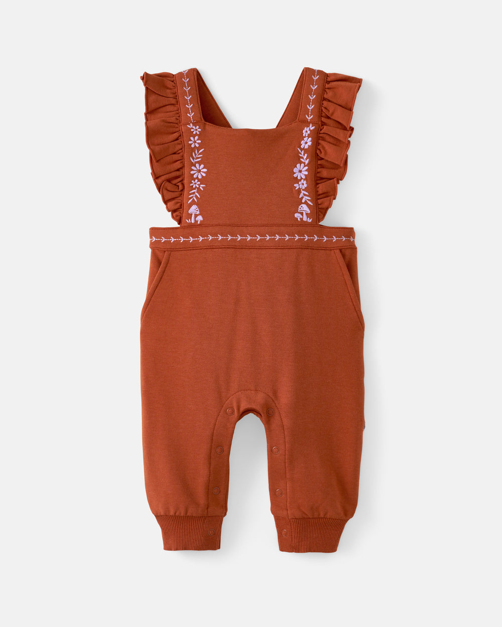 A toddler's rust-orange romper with ruffled shoulder straps and white embroidered floral details, shown flat on a light gray background.