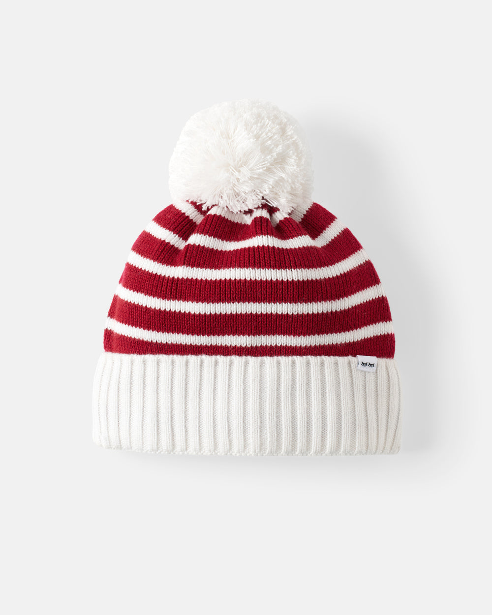 A red and white striped knit beanie with a fluffy white pom-pom on top and a ribbed white cuff, shown against a light gray background.