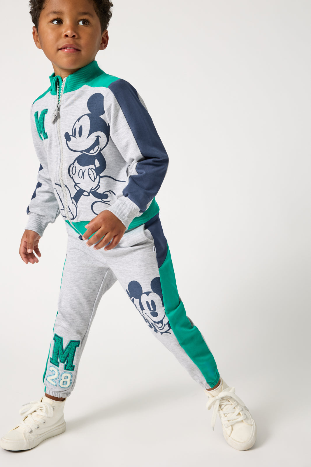 Boy wearing the Disney Mickey Mouse Sports Club Panel Jogger