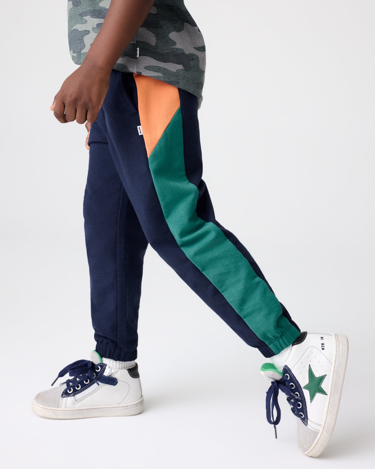 Boy wearing the Classic Navy Panel Jogger with sneakers