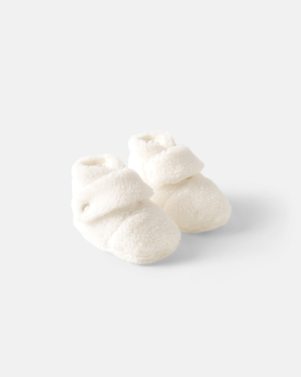 Flat lay of the Soft White Sherpa Crossover Booties