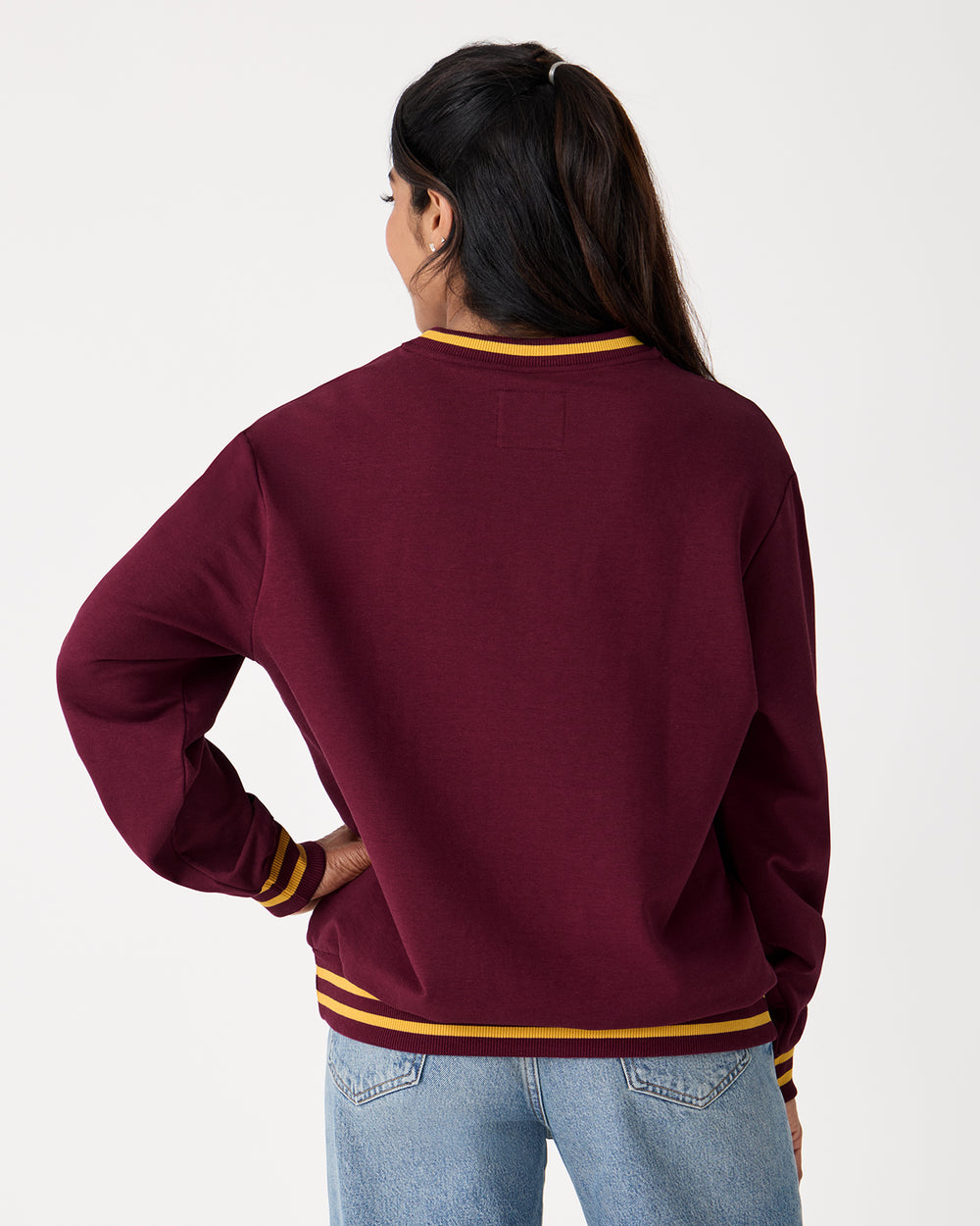 Back view of woman wearing the Harry Potter™ Spellbinding Studies Adult Crewneck Sweatshirt