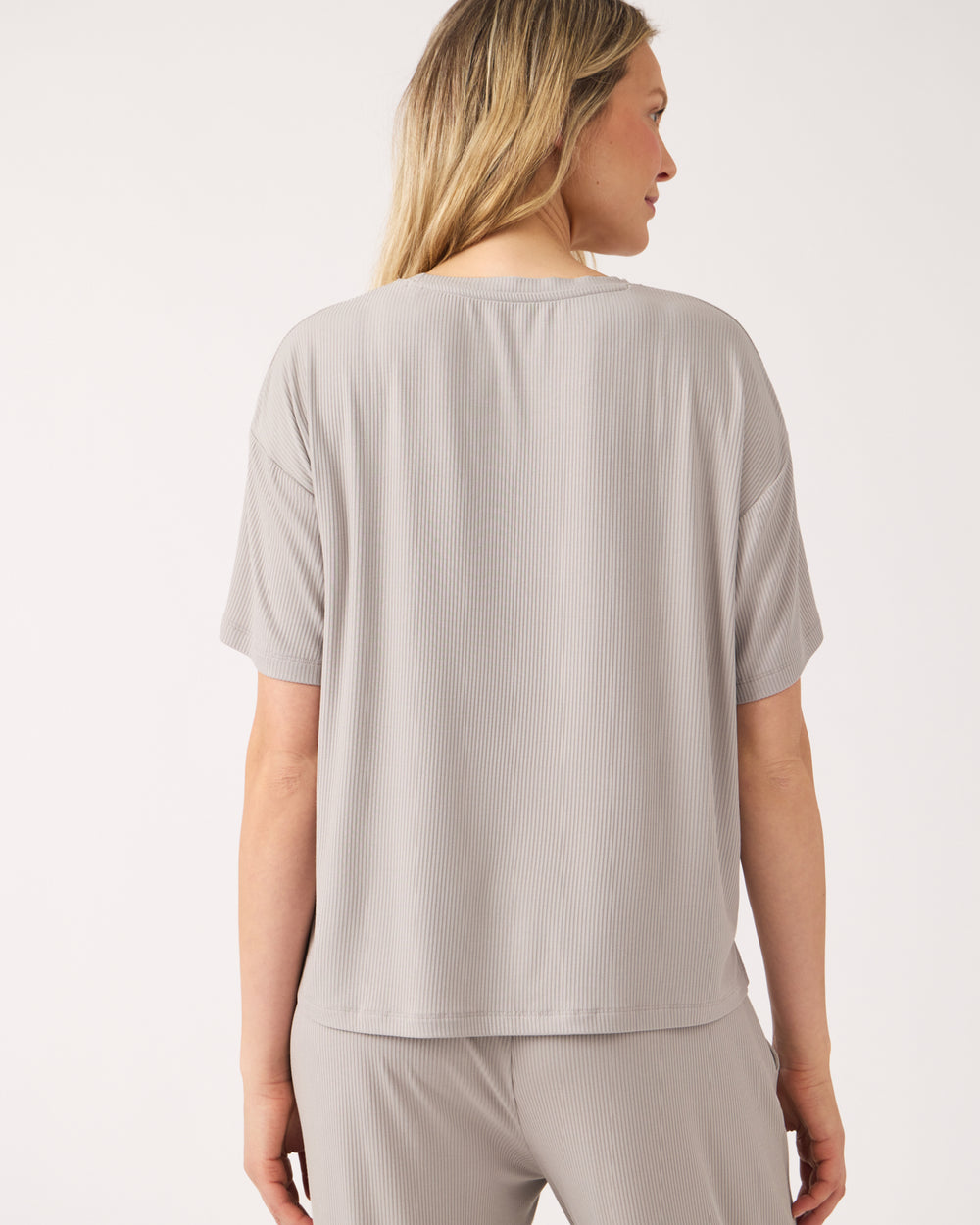 Back view of woman wearing the Dove Gray Women's Ribbed Boxy Tee