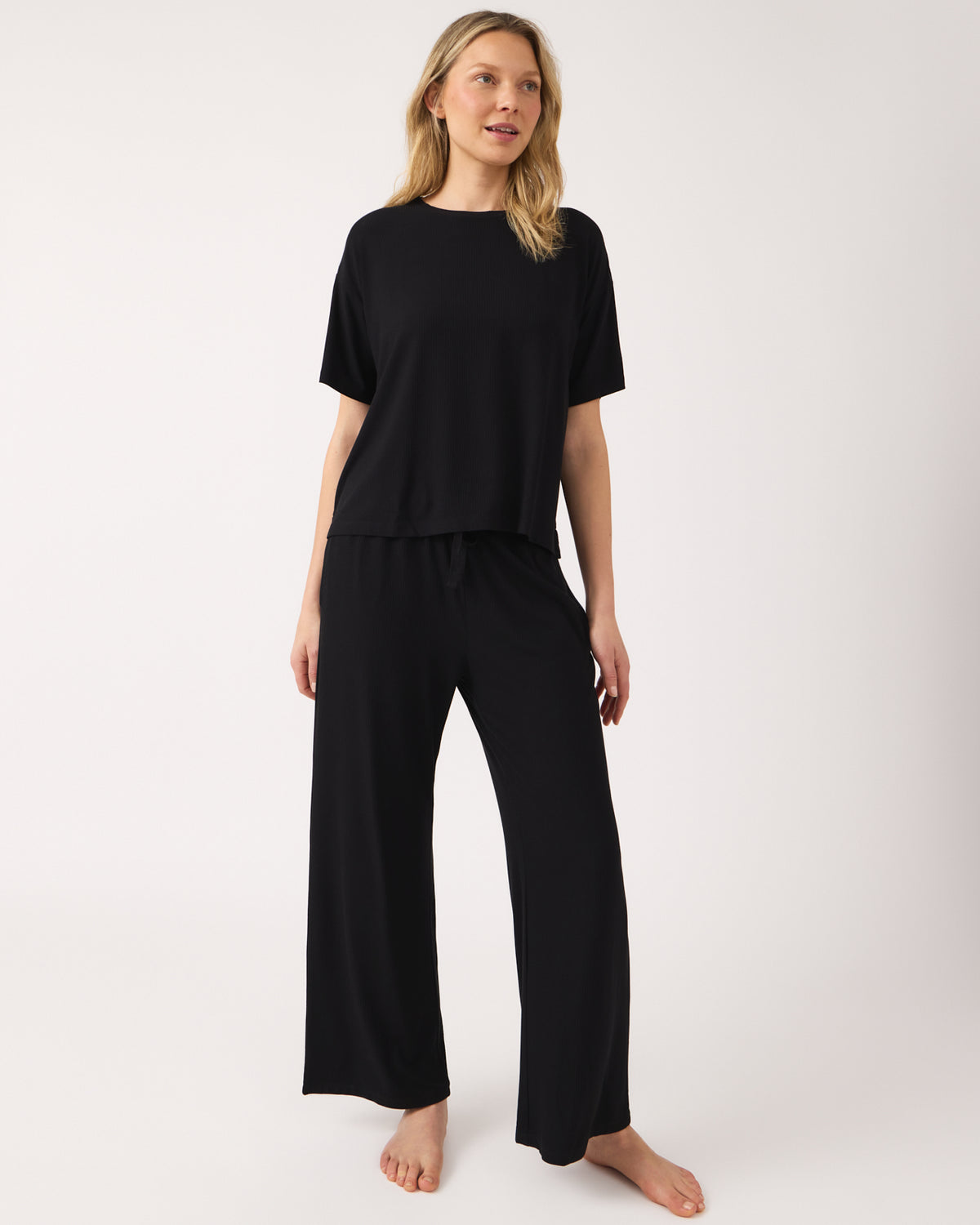 Woman wearing the Black Women's Ribbed Boxy Tee and Pants