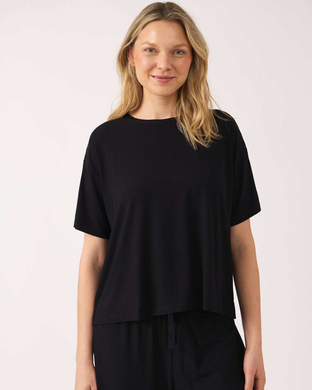 Woman wearing the Black Women's Ribbed Boxy Tee