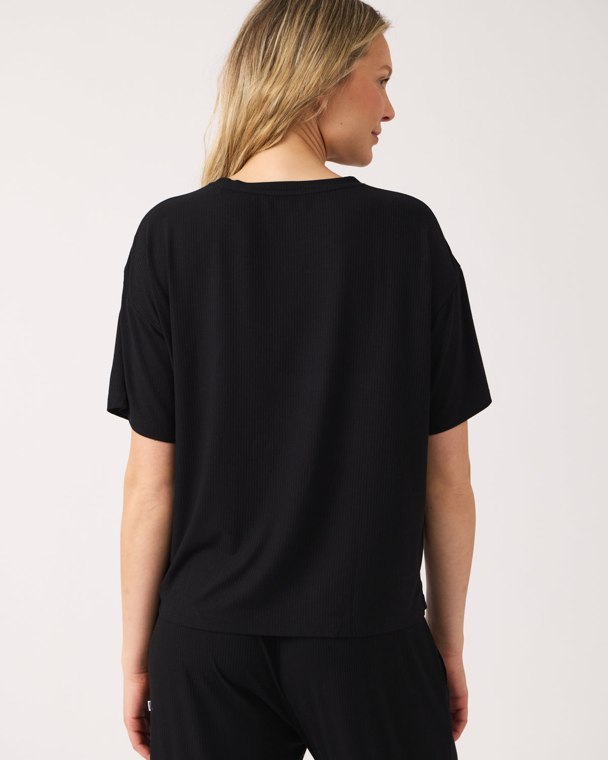 Back view of woman wearing the Black Women's Ribbed Boxy Tee