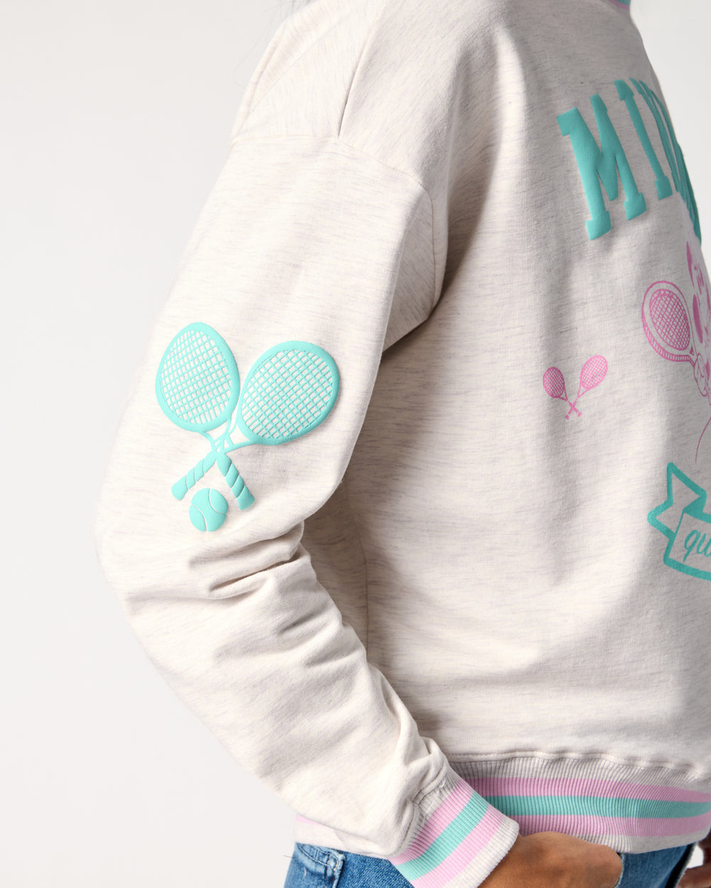 Close up of the sleeve on the Disney Minnie Mouse Queen of Swing Women's Crewneck Sweatshirt