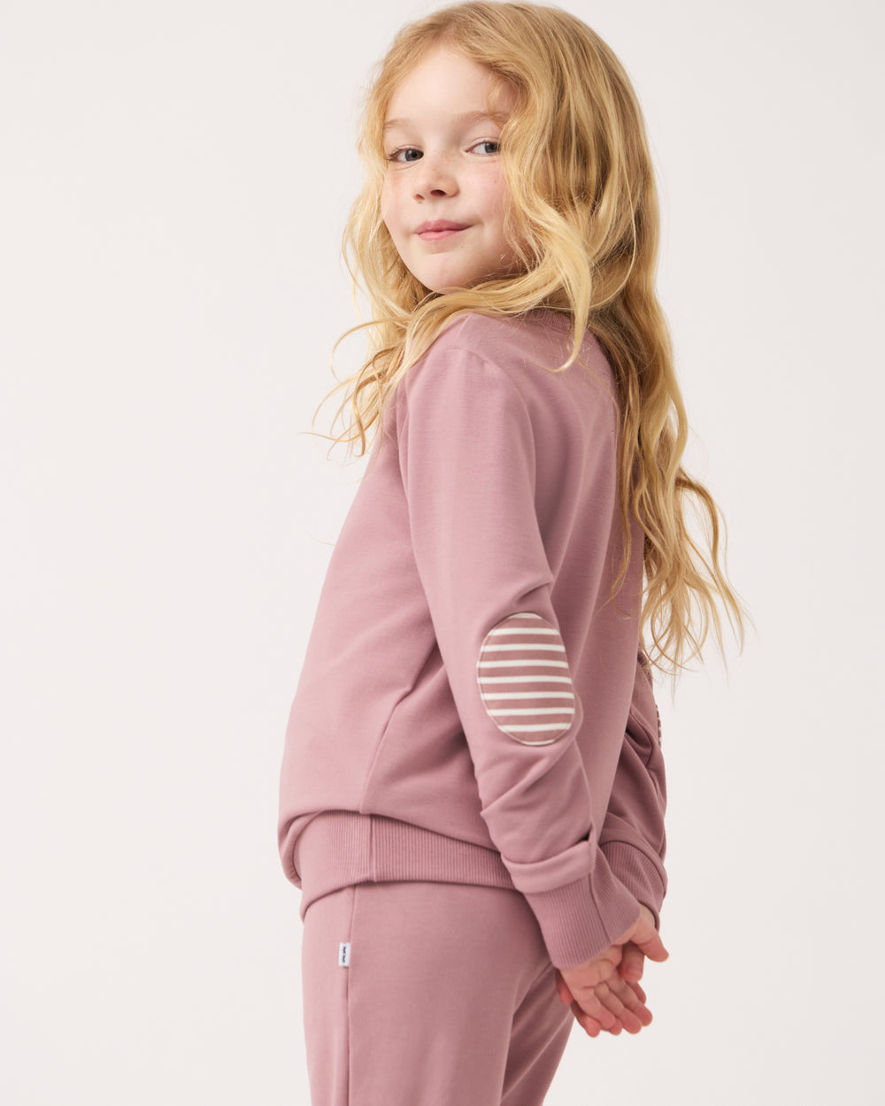 Side view of girl wearing the Rosewood Crewneck Sweatshirt