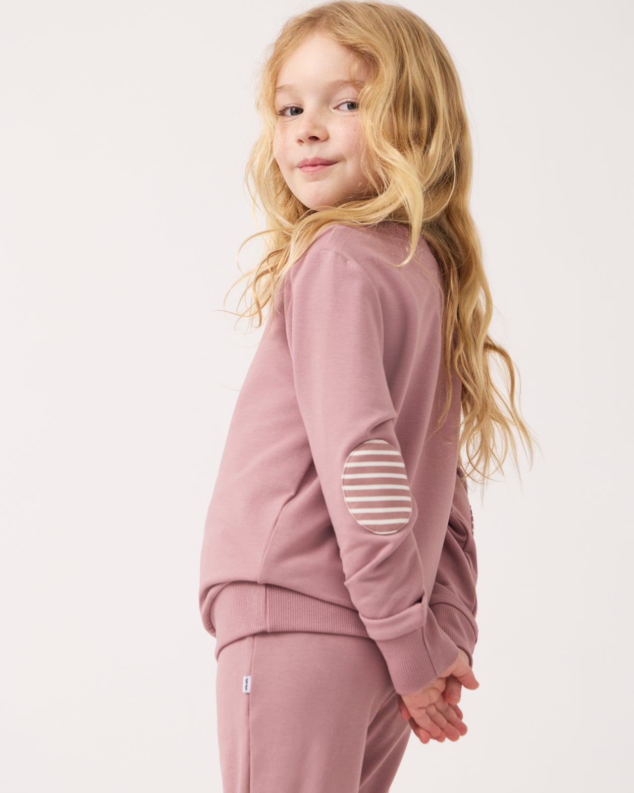 Side view of girl wearing the Rosewood Crewneck Sweatshirt