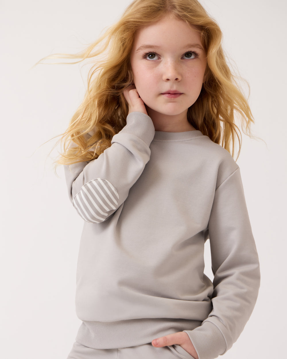 Close up of girl wearing the Dove Gray Crewneck Sweatshirt