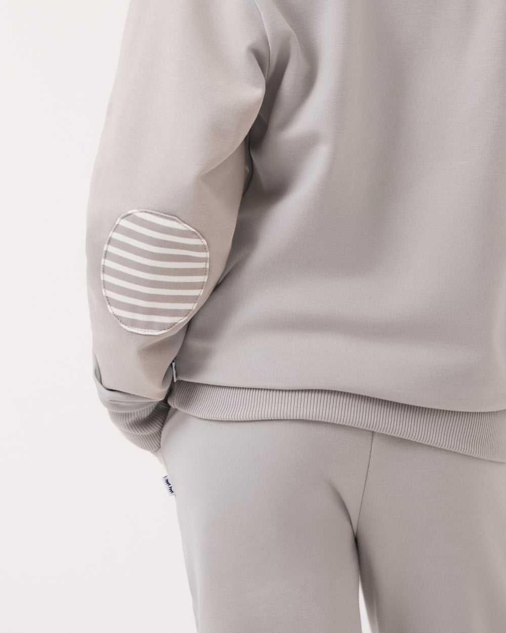 Close up of the elbow patch on the Dove Gray Crewneck Sweatshirt