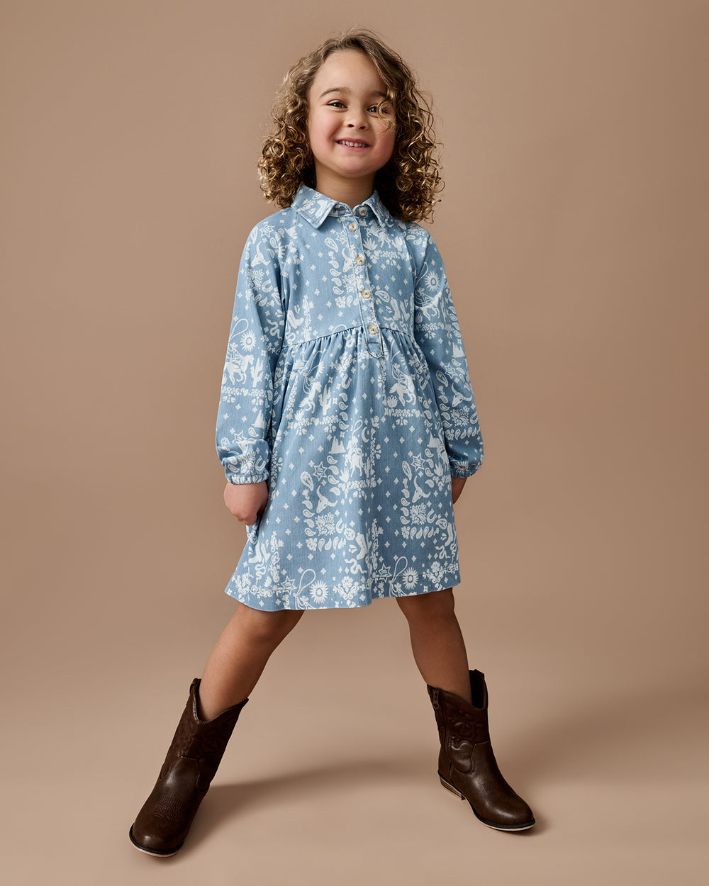 Girl wearing the Bandana Blues Denim Shirt Dress with leather boots