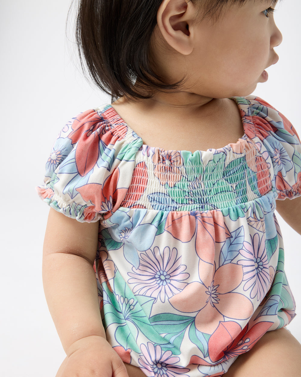 Close up of the smocked detail on the Shoreline Blooms Smocked Bubble Romper