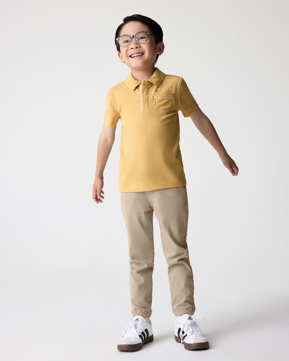 Alternate boy wearing the Sand Drift Denim Jogger and Honey Polo Shirt