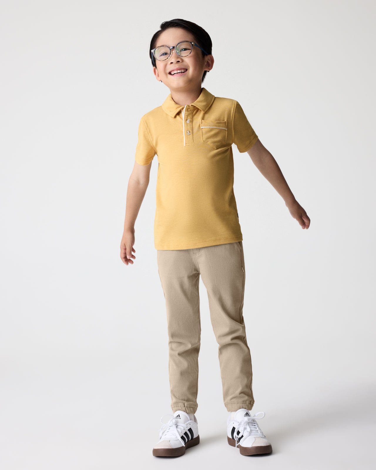 Alternate boy wearing the Sand Drift Denim Jogger and Honey Polo Shirt