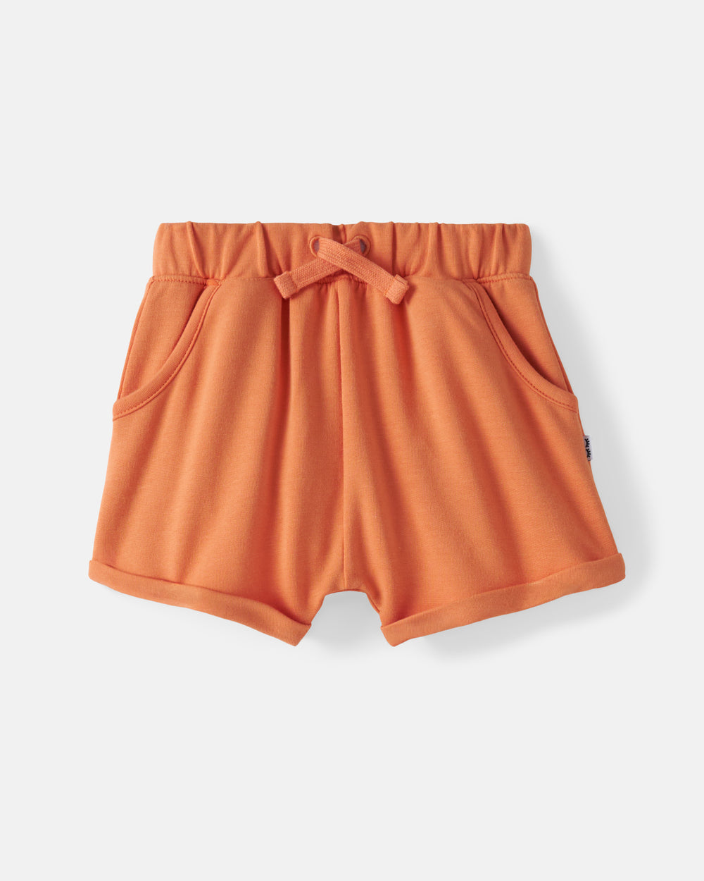 Flat lay of the Orange Haze Cuffed Baby Shorts