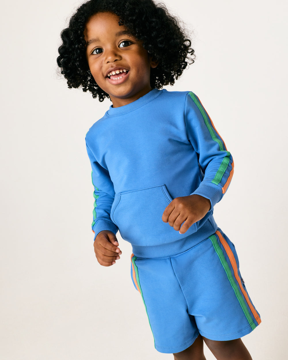 Alternate boy wearing the Major Blue Side Stripe Short and Pocket Sweatshirt