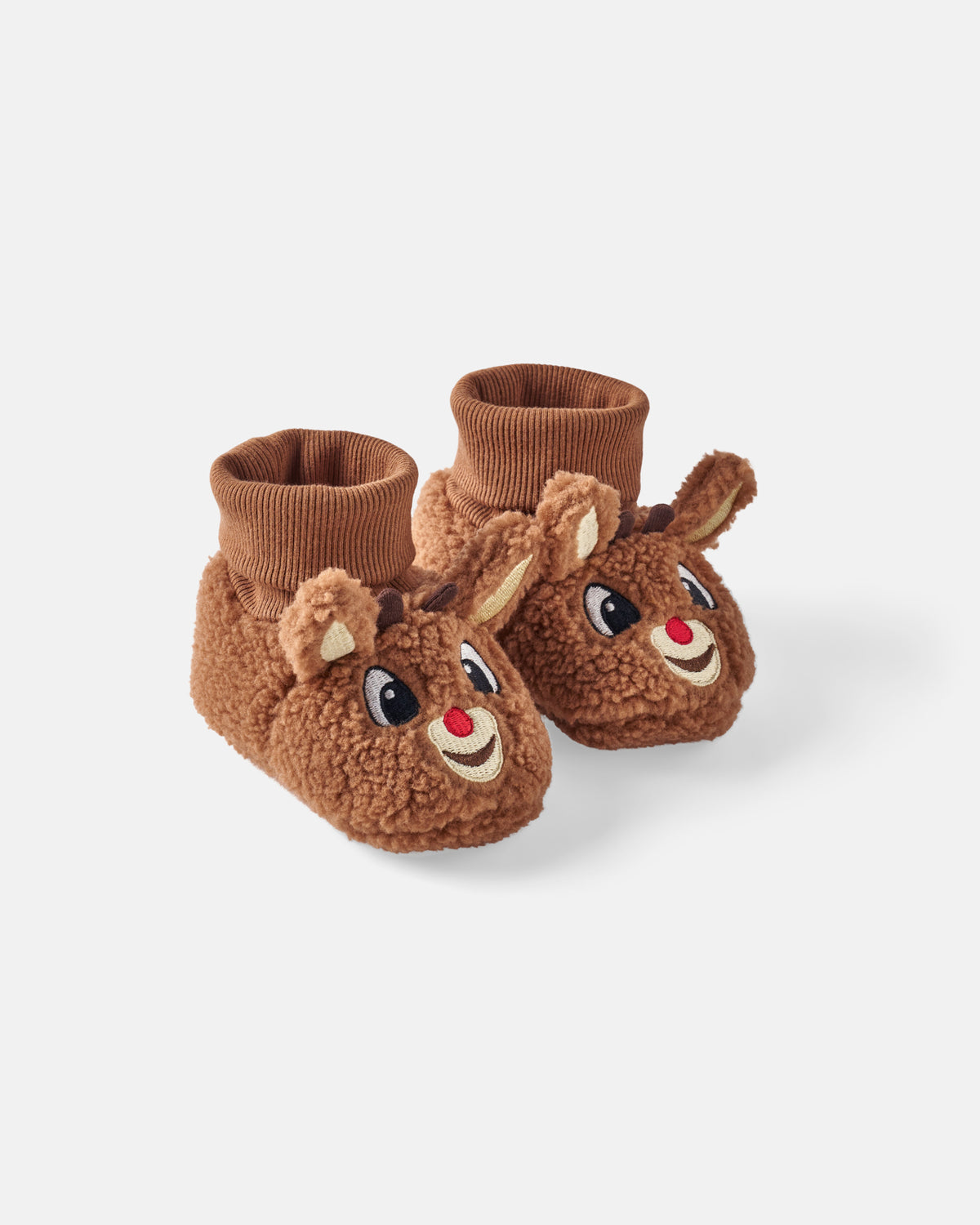 A pair of brown plush booties designed to look like Rudolph faces, featuring embroidered eyes, red noses, and small ears, with ribbed knit cuffs, shown on a light gray background.