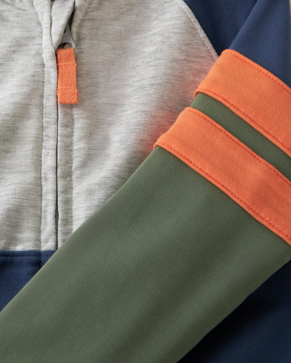 Close up of the sleeve details on the Moss Colorblock Zip Hoodie