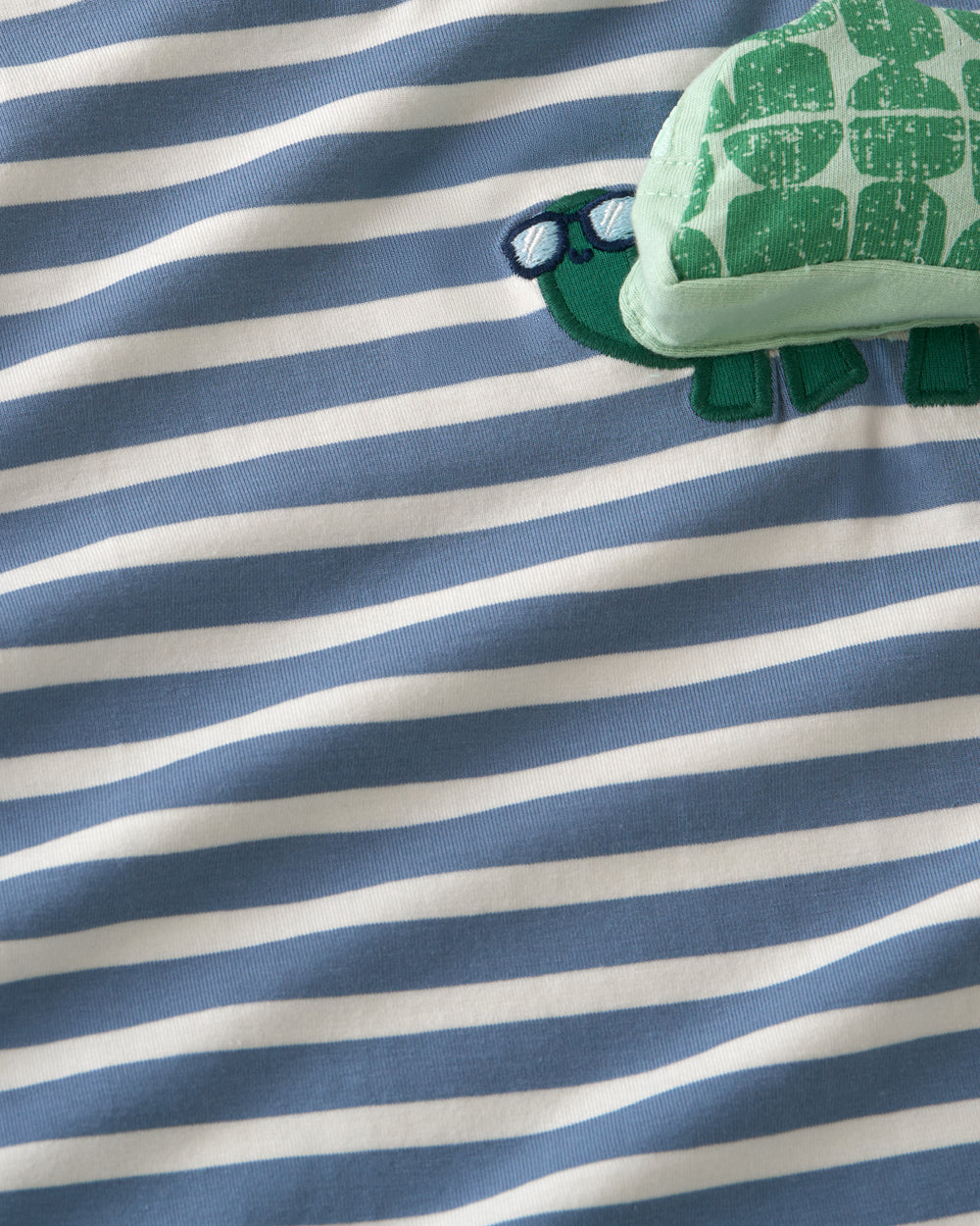 Close up of the striped fabric on the Zippy Turtle Relaxed Pocket Tee