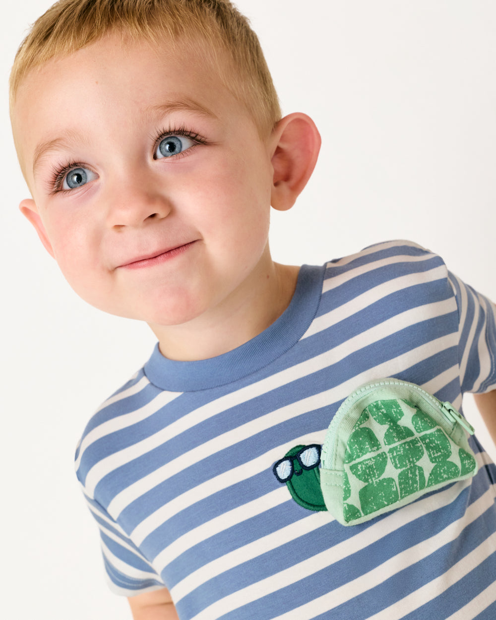 Close up of child wearing the Zippy Turtle Relaxed Pocket Tee