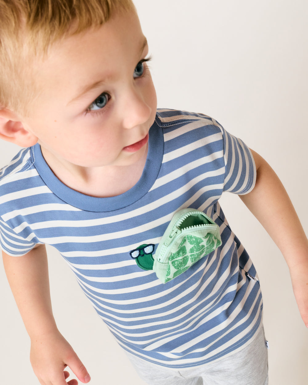 Close up of the zipper pocket on the Zippy Turtle Relaxed Pocket Tee