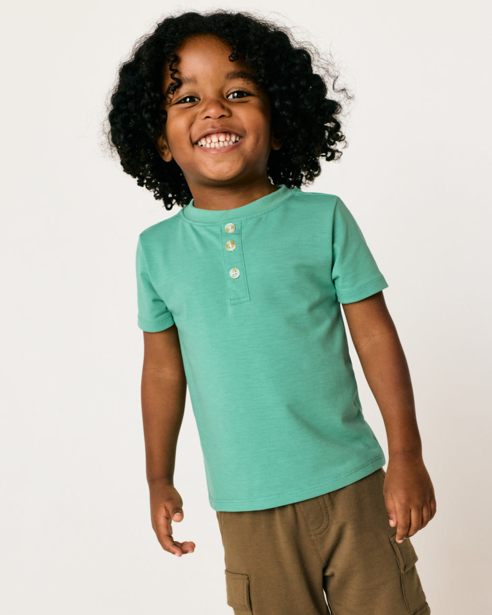 Close up of boy wearing the Cool Jade Henley Tee