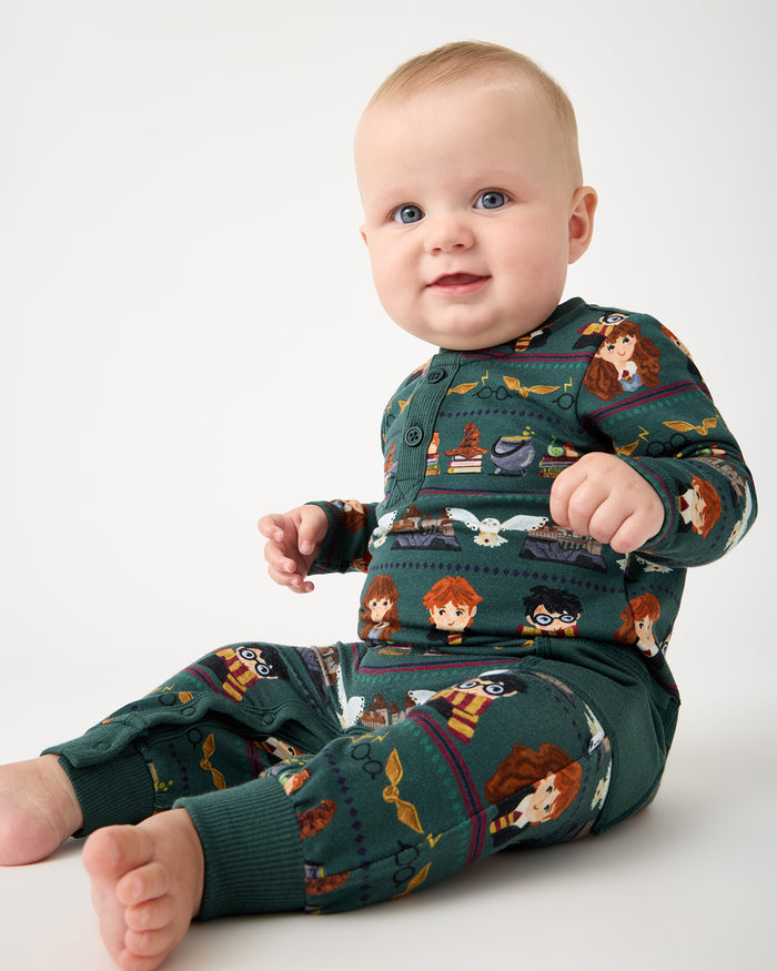 Sitting baby wearing the Harry Potter™ Spellbinding Studies Henley Romper