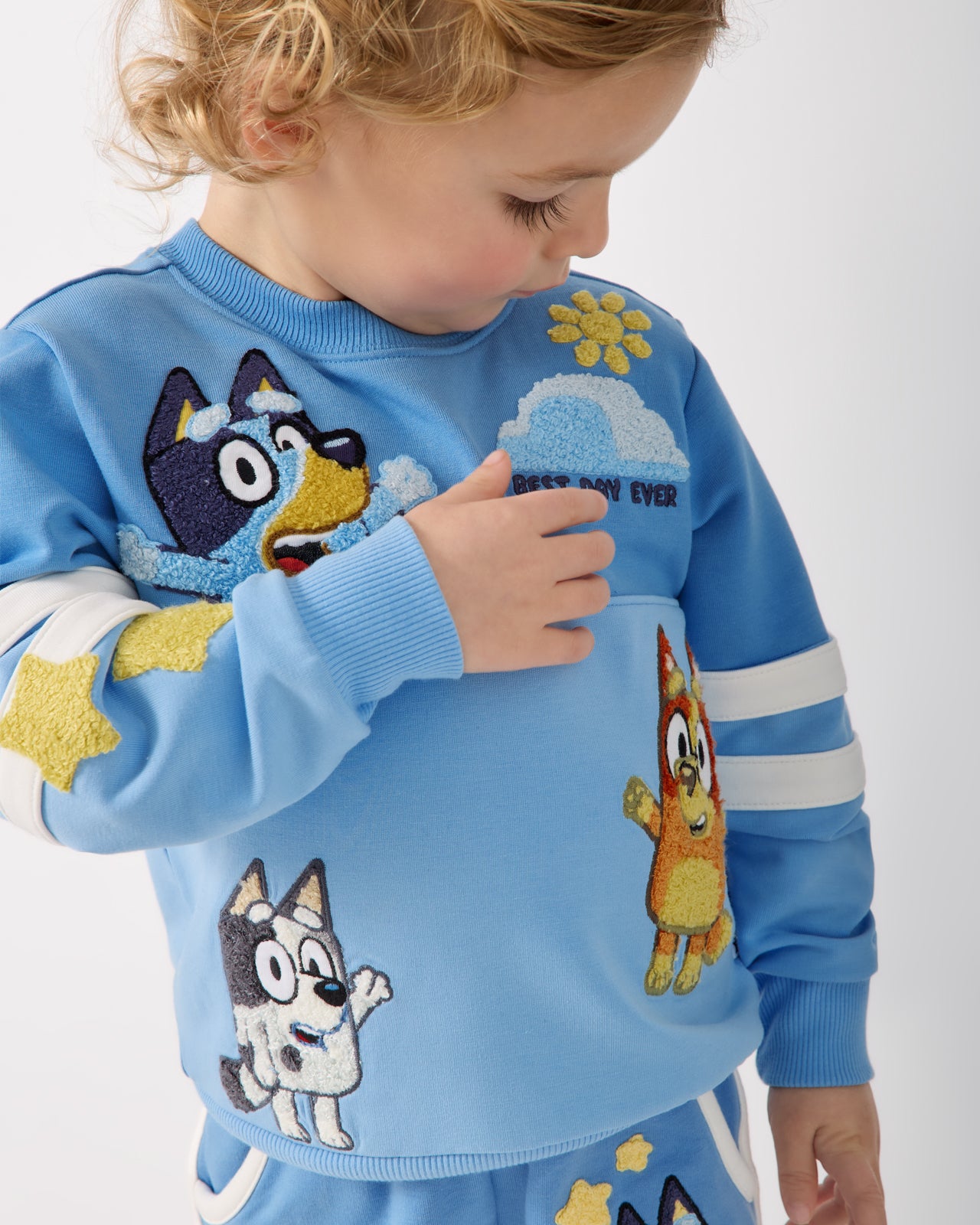 Close up of child wearing the Bluey Best Day Ever Crewneck Sweatshirt