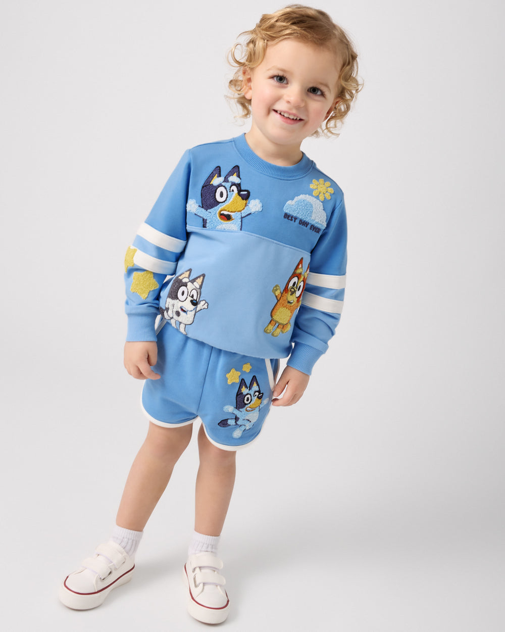 Child wearing the Bluey Best Day Ever Dolphin Shorts and Crewneck Sweatshirt