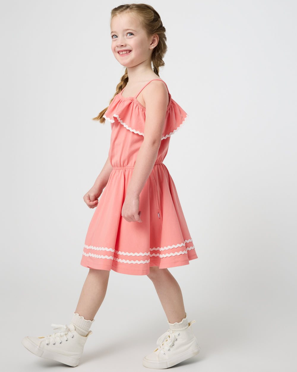 Walking girl wearing the Beach Coral Asymmetrical Dress