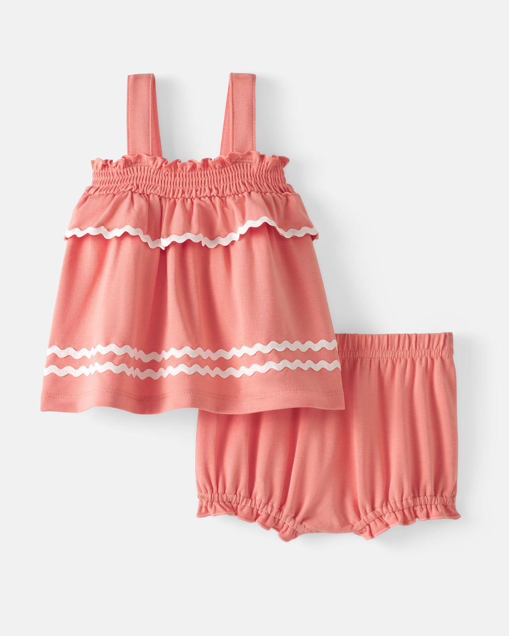 Flat lay of the Beach Coral Smocked Top with Bloomer