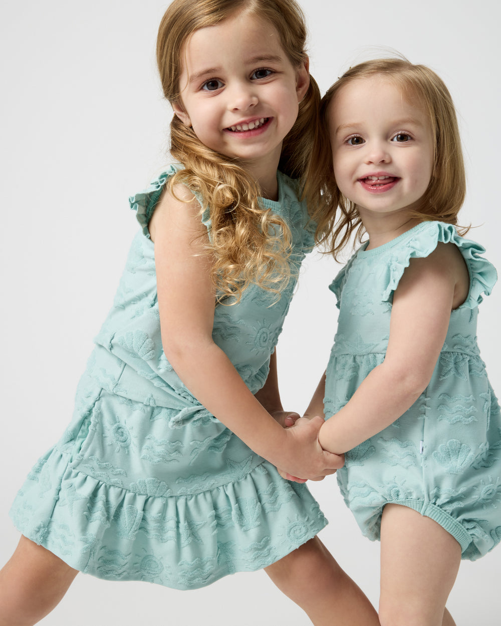 Two girls wearing matching Coastal Rays play styles