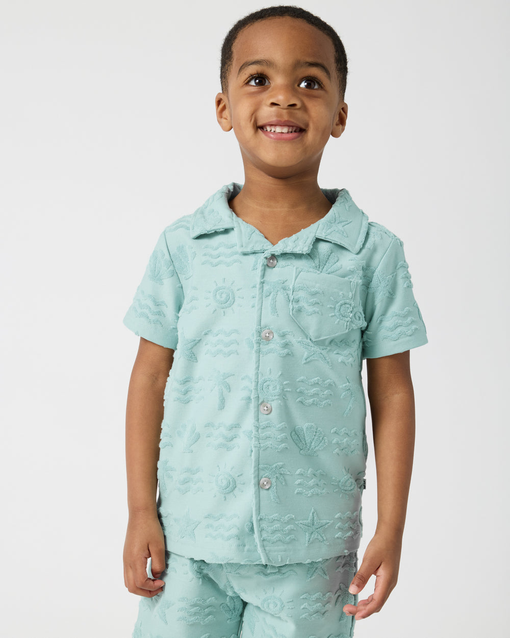 Boy wearing the Coastal Rays Button Down Polo