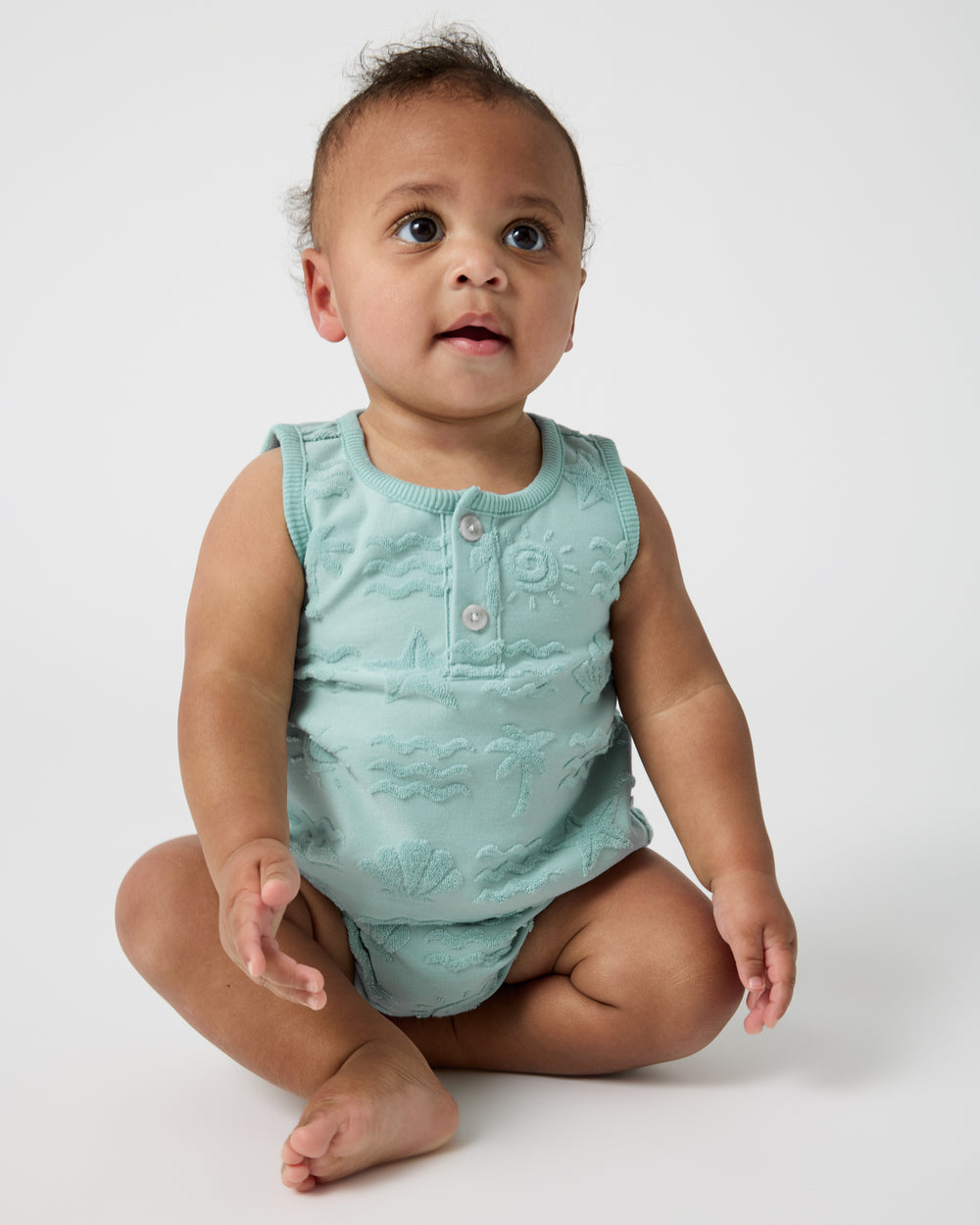Sitting baby wearing the Coastal Rays Henley Tank Set