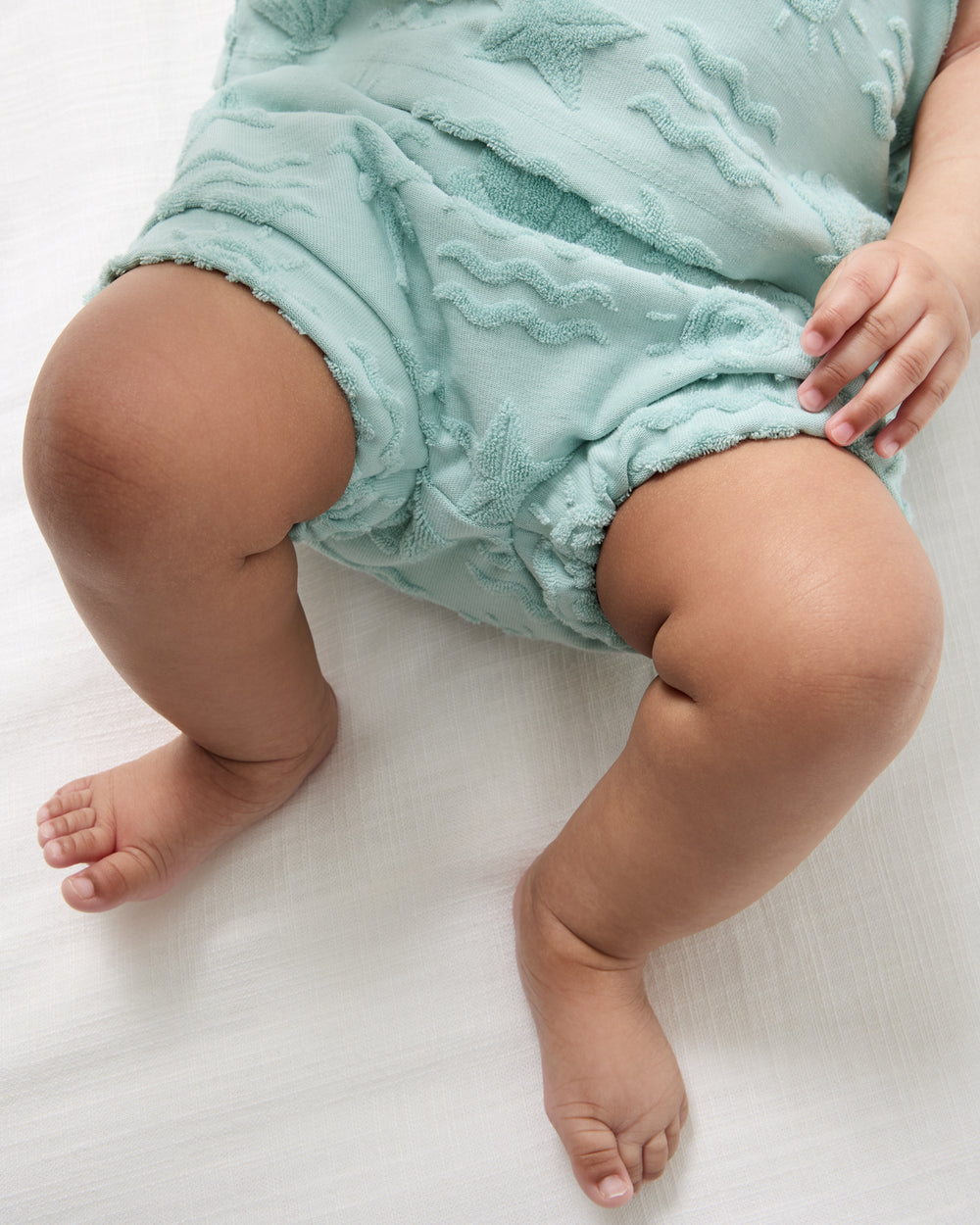 Close up of the shorts in the Coastal Rays Henley Tank Set