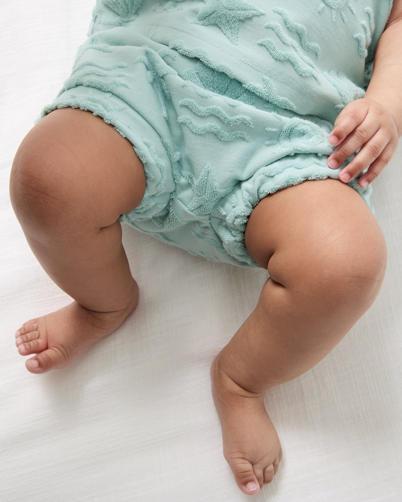 Close up of the shorts in the Coastal Rays Henley Tank Set