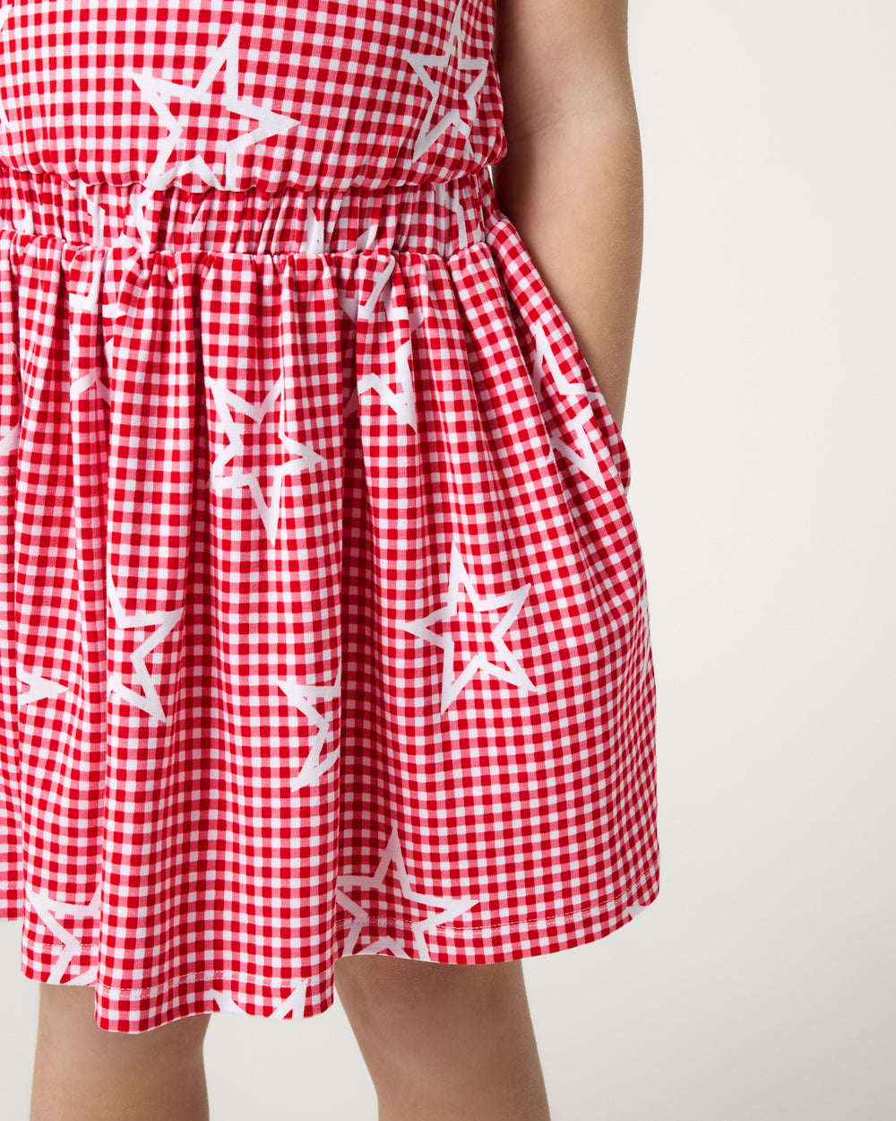 Close up of the skirt detail on the Celebration Gingham Bow Back Twirl Dress