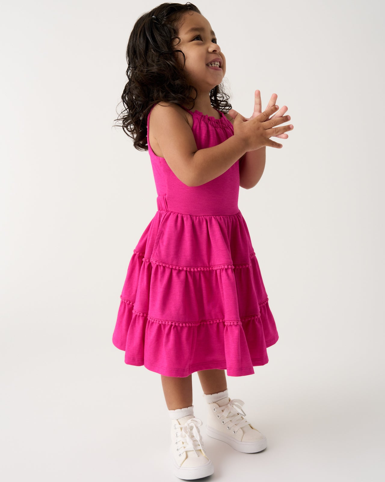 Girl wearing the Pink Punch Open Back Tiered Dress with white sneakers