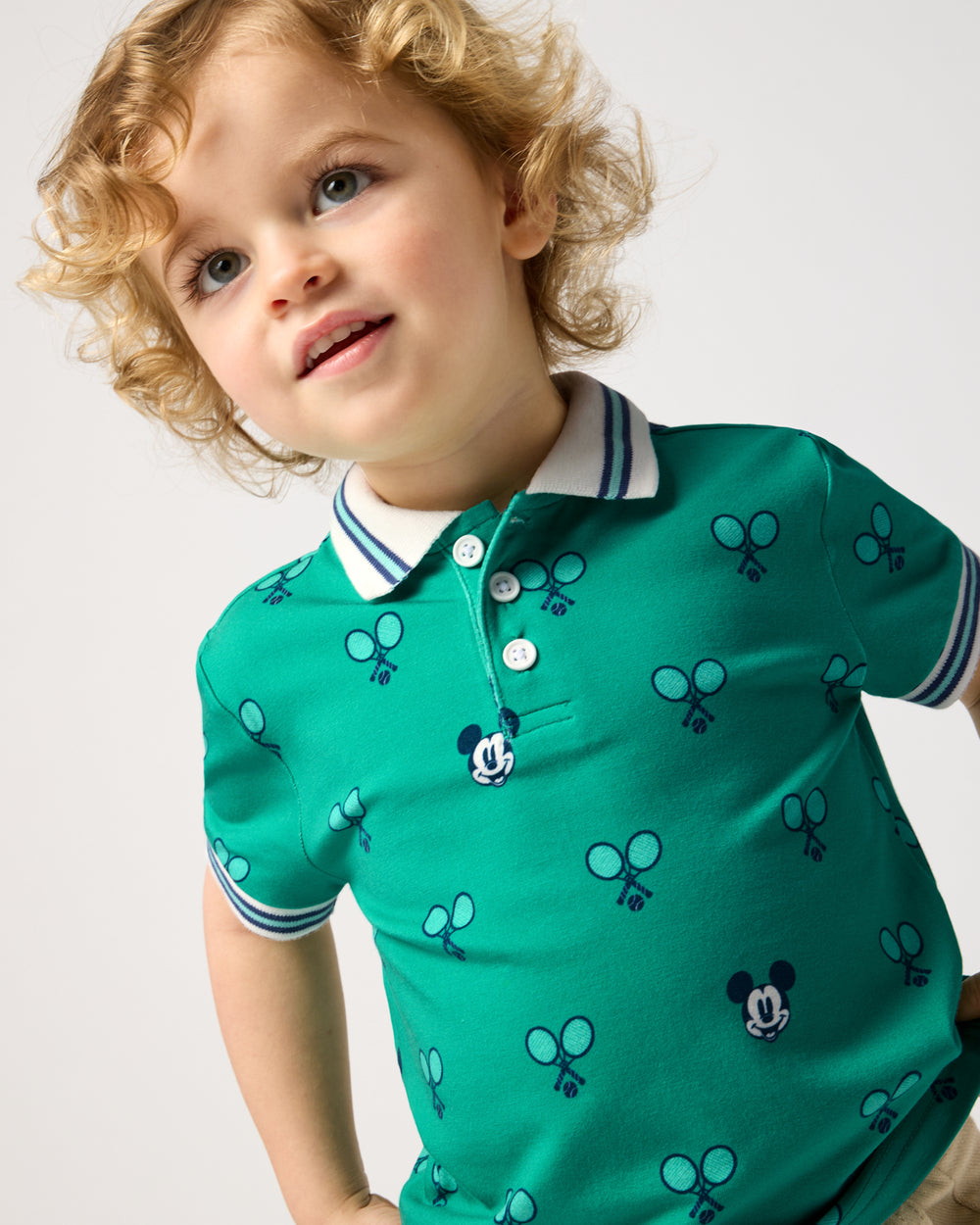Boy wearing the Disney Mickey Mouse Racket Rally Polo Shirt