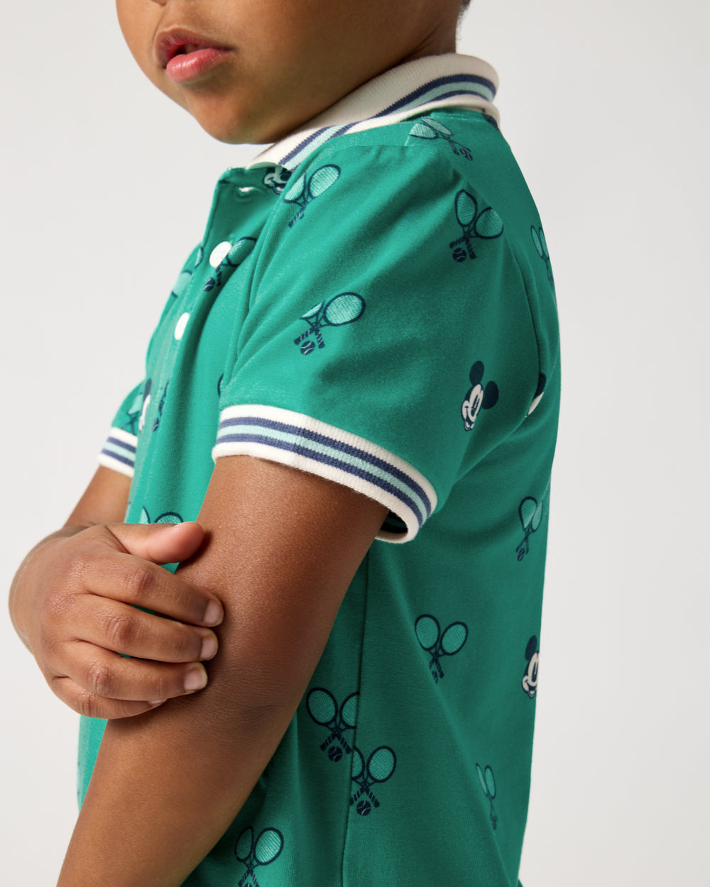 Close up of the sleeve detail on the Disney Mickey Mouse Racket Rally Polo Shirt