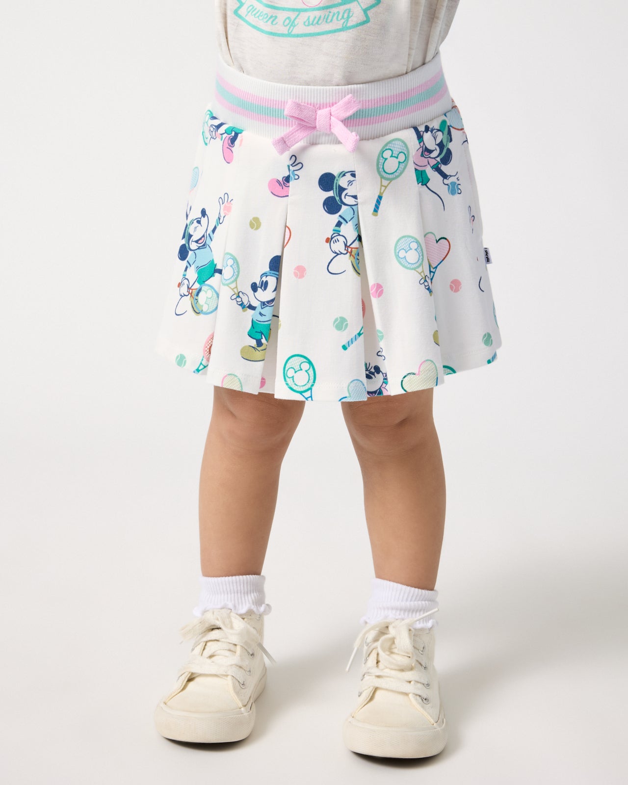 Girl wearing the Disney Mickey Mouse & Minnie Mouse Match Pleated Skort